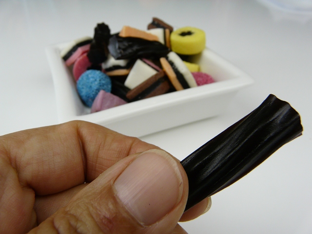 Liquorice Allsorts with hand