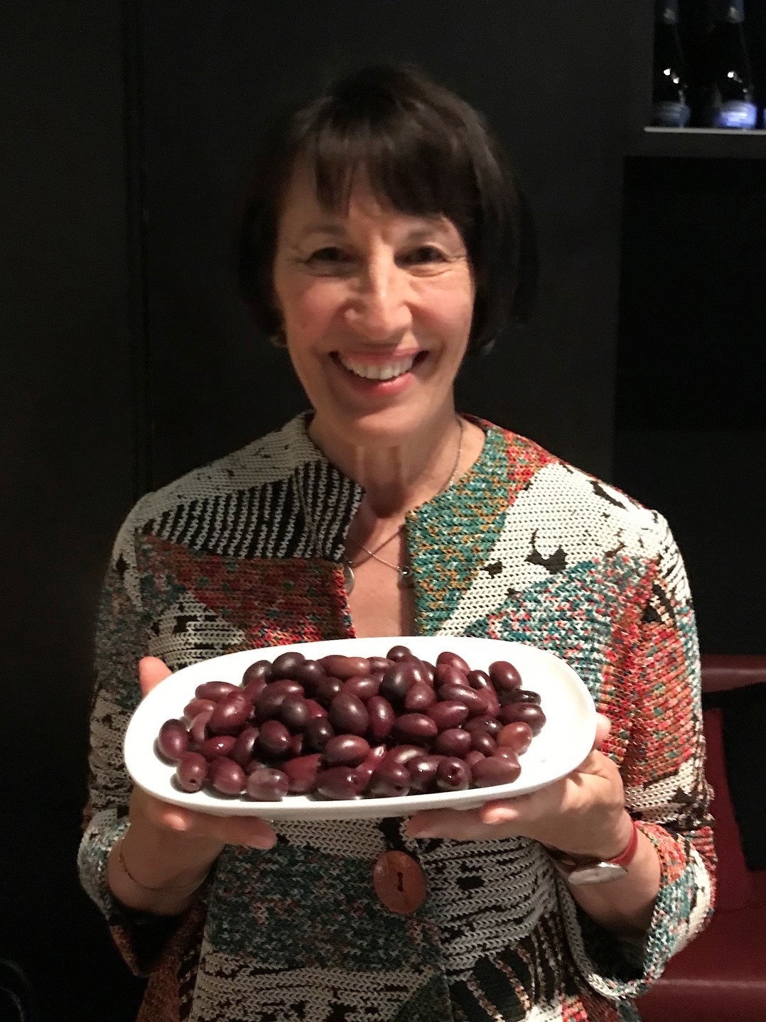 Cath holding Black olives