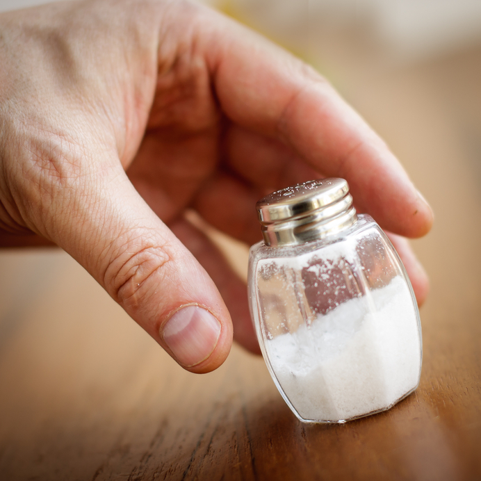 Salt shaker by male hand