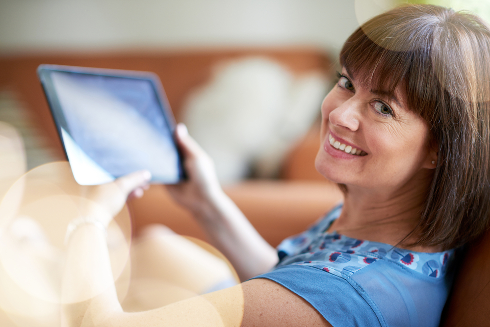 Woman reading digital NL