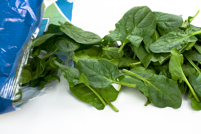 Fresh and washed spinach out of the plastic package. 