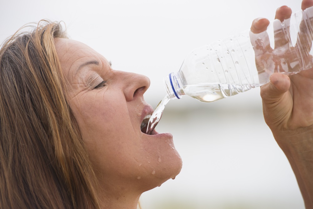 Sweaty woman drinking Bottle Lspe