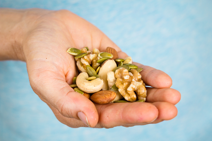 Mixed nuts in hand
