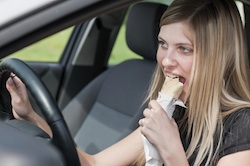 Girl in car eating small
